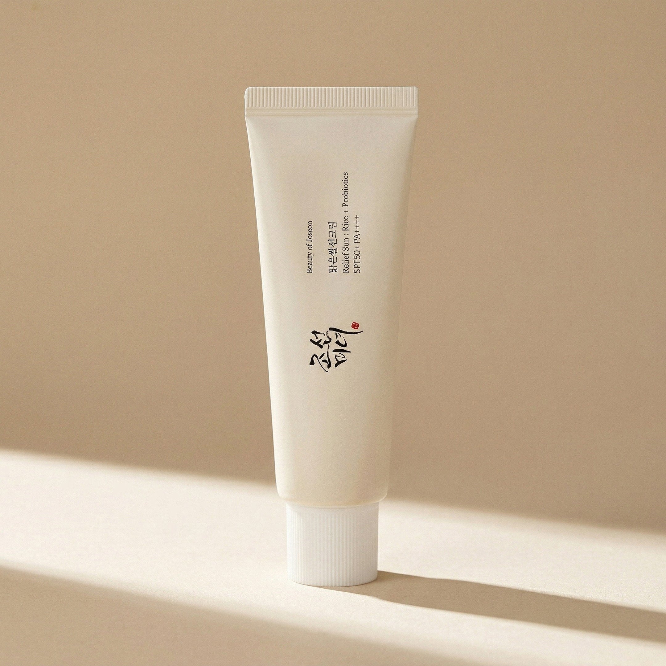 Beauty of Joseon — Relief Sun : Rice + Probiotics SPF50+ PA++++ 50ml — editorial — fundo bege