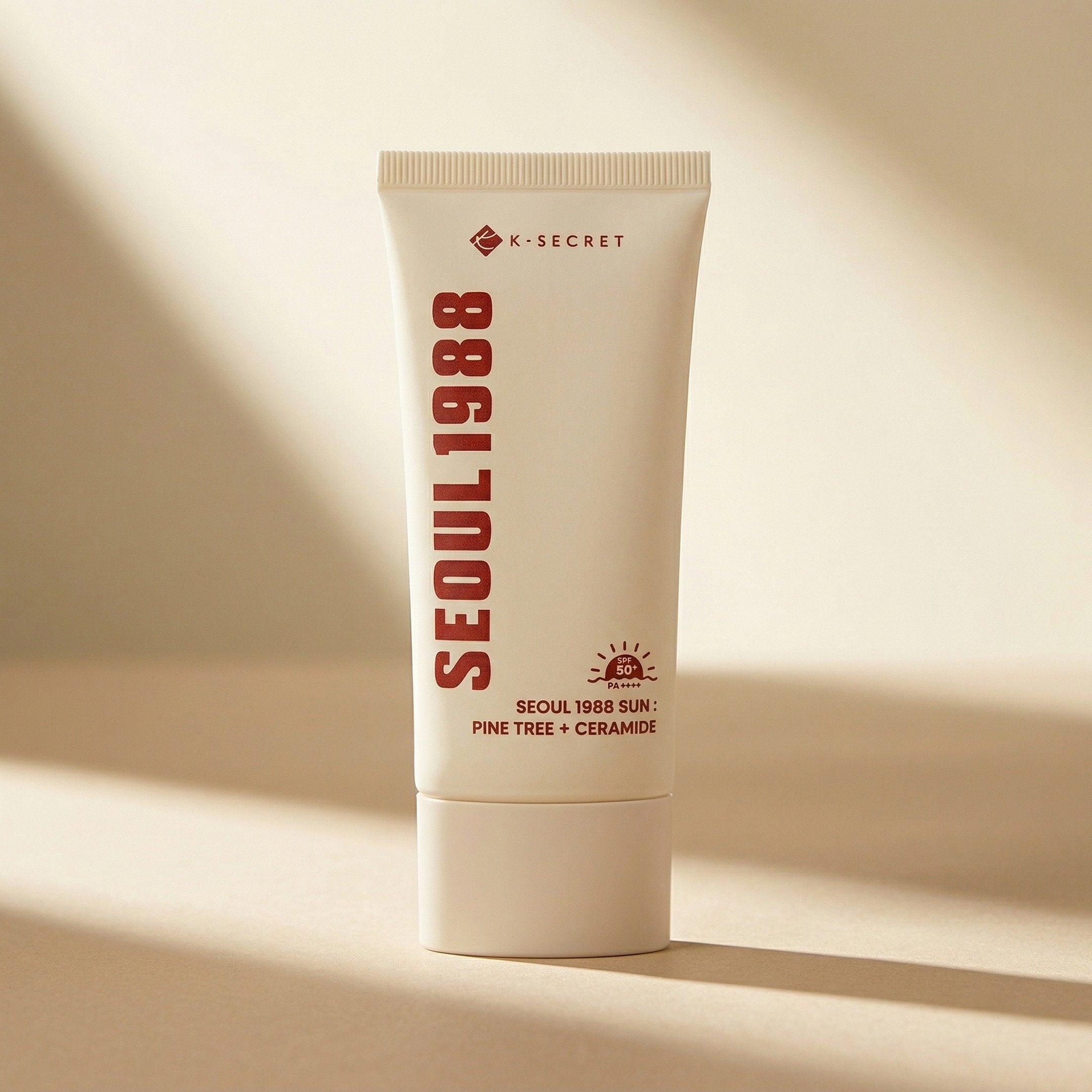 K-Secret — SEOUL 1988 Sun : Pine Tree + Ceramide SPF50+ PA++++ 50ml — editorial — fundo bege